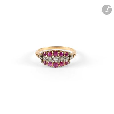 a close up of a gold ring with pink and white stones