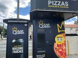 two vending machines on the side of the road