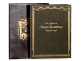 un livre noir aux bords dorés et à la couverture dorée