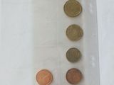 a lot of coins in a plastic bag on the table