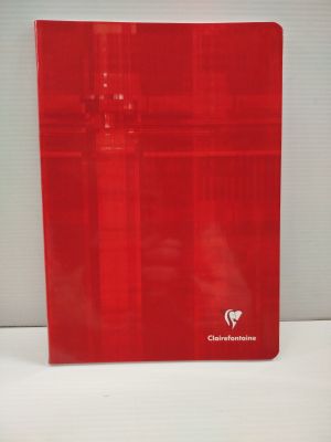 le cahier rouge est posé sur une surface blanche