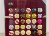 a glass display case with a lot of badges on it