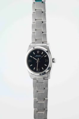 an image of a wrist watch with a black dial on a silver bracelet