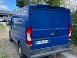 a blue van that is parked on the side of the road