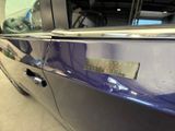 a close up of a car door handle with a sticker on it