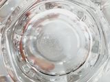 a person holding a glass of water in their hand