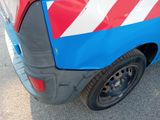 an image of a van with a red, white and blue stripe painted on the side of it
