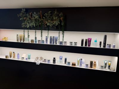 many different types of skin care products displayed on the wall