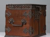 a wooden box with a handle on it on a table