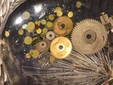 a clock that has gears inside of it on the table