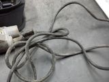 a cord that is plugged into a device on a table