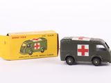 a small toy truck with a red cross on it