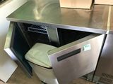 a dishwasher that is sitting in the middle of a kitchen