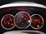 a close up of a car dashboard with various gauges