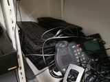 a shelf that has a bunch of electronics on top of it