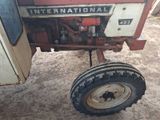 a tractor that is parked in the dirt