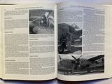 an open book with a picture of a plane on it