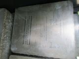 a large sheet of paper sitting on top of a pile of cement