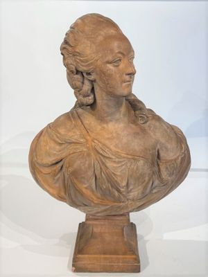an antique bust of a woman on a pedestal with a white background