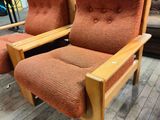 two chairs that are sitting on a wooden floor