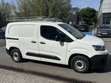 a white van that is parked in a parking lot