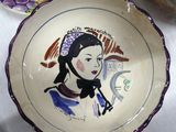 a bowl that has a picture of a woman on it