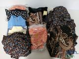 many different types of cloths laid out on a table