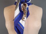 a mannequin with a blue and white scarf on it