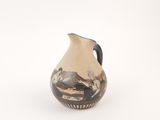 a small vase with a painting on it on a white surface