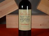 a bottle of wine that is sitting on a table
