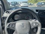 dashboard view of a car with a steering wheel and dashboard gauges