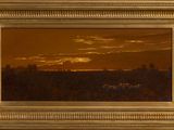 an oil painting of a sunset in a golden frame on a wall