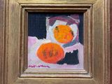 a painting of oranges in a gold frame on the wall