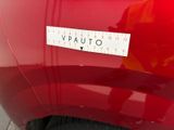 a sticker that says vauto on the side of a red car