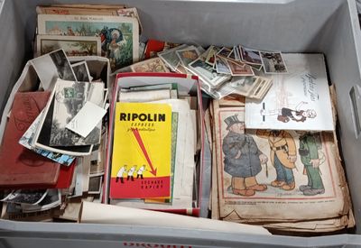 a box full of old books and papers in it