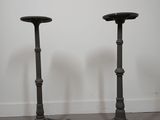 pair of cast iron candlesticks in the shape of a table