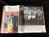 two pages of a magazine with a picture of a man in a racing car