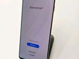 the back of a samsung phone with a phone stand on top of it