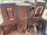 a close up of a vehicle ' s dashboard with the door open