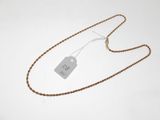 a close up of a necklace with a tag on it