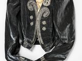 an old black velvet jacket with a lace collar and buttons