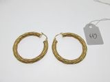 a pair of gold plated hoop earrings
