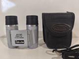 two binoculars that are sitting on a table