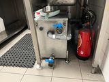 an image of a kitchen with a fire extinguisher and a fire extinguisher