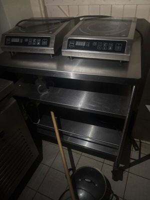 two stoves that are sitting on top of a table