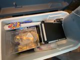 a cooler that has a stuffed animal inside of it