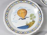three plates with a hot air balloon painted on them