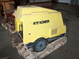 a yellow machine that is sitting on a pallet