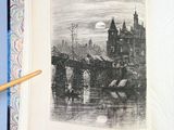 an open book with a drawing of a castle on it