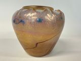 a vase that is sitting on a white surface